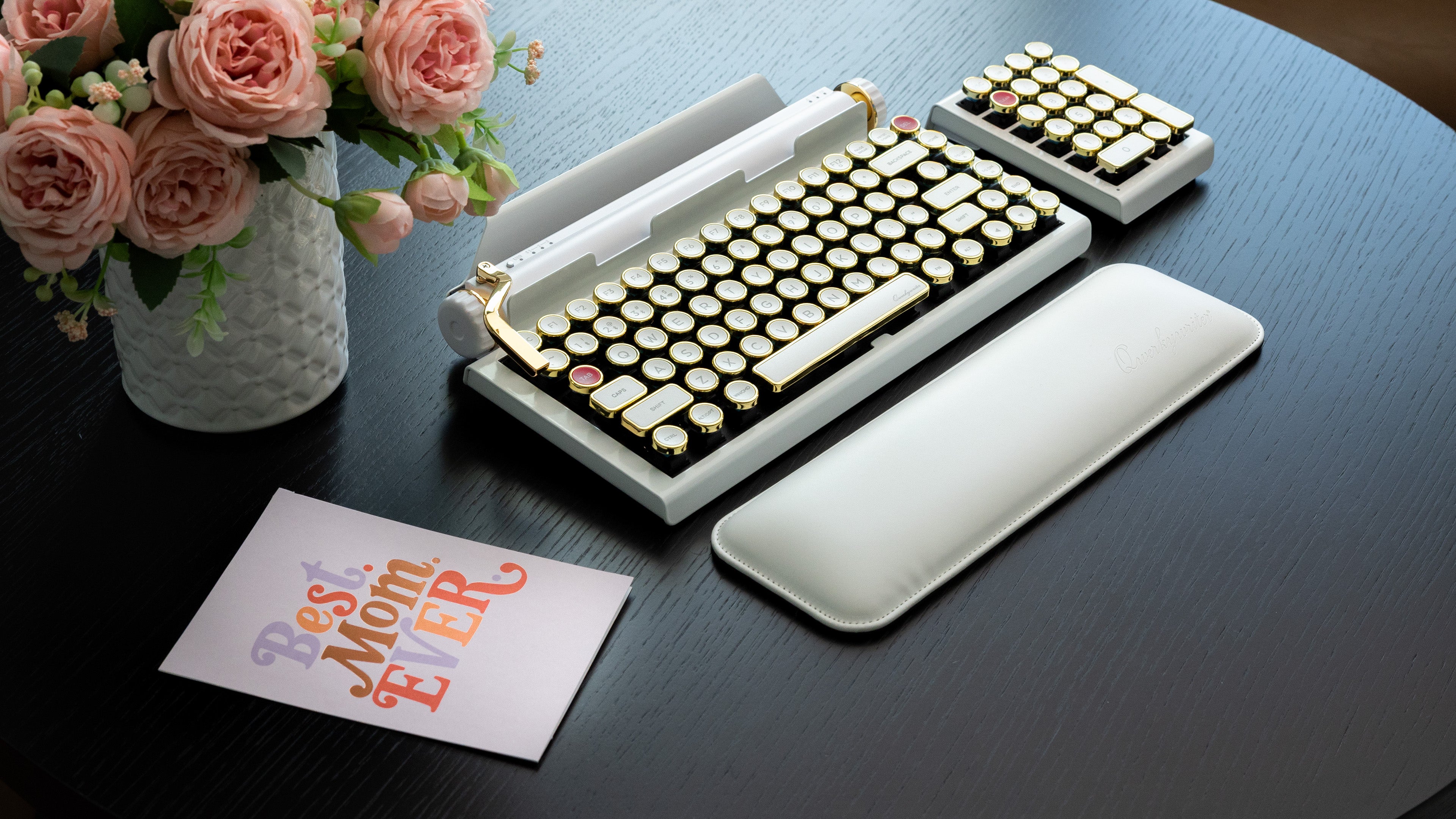 Qwerkywriter typewriter keyboard best in class premium all aluminum body in white gold on dark color wood table
