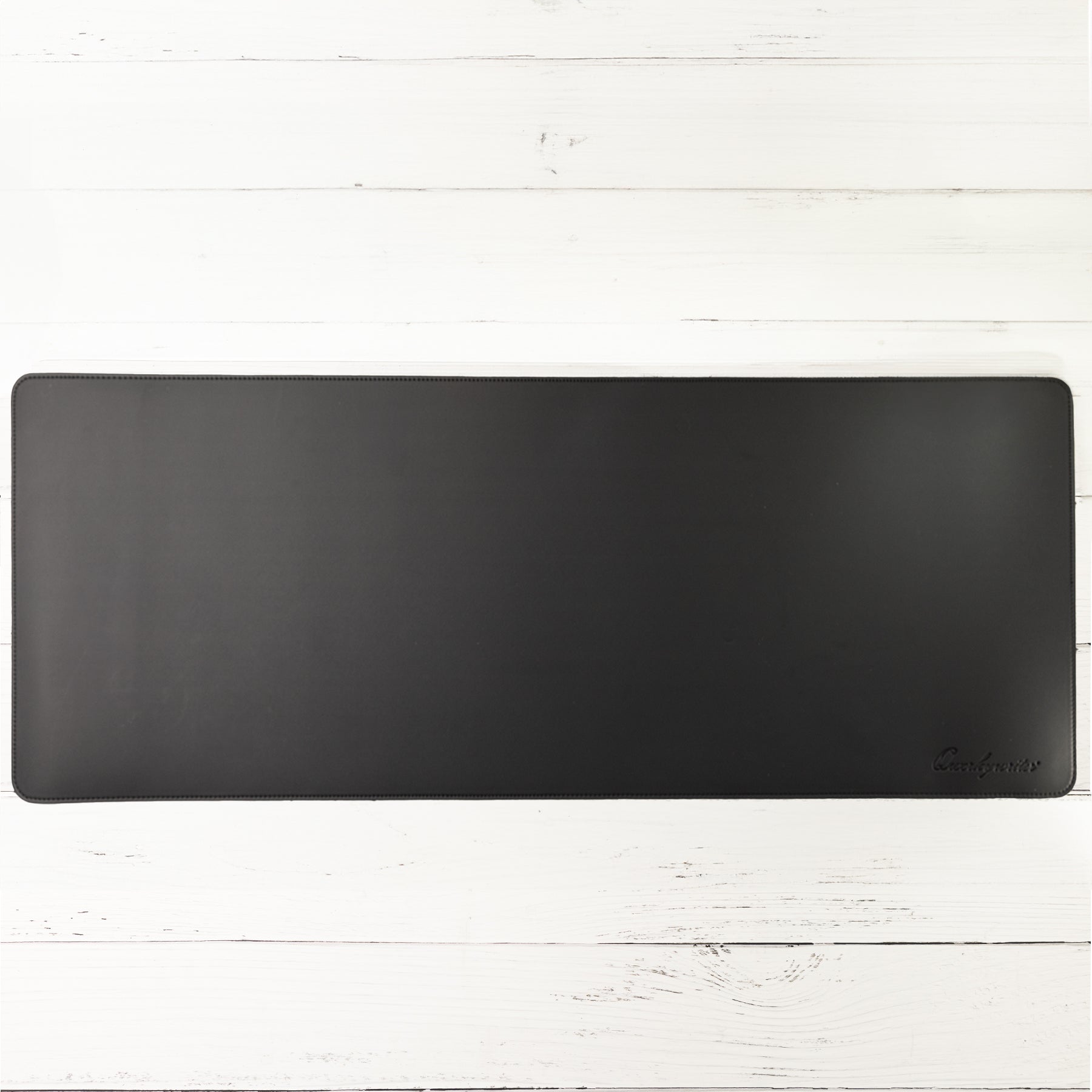 Qwerkywriter typewriter keyboard best in class premium all aluminum body official black desk mat on white wood background US ANSI layout