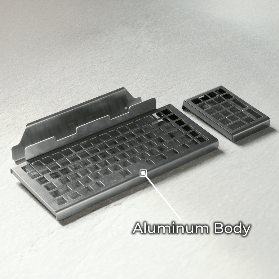 Qwerkywriter typewriter keyboard best in class premium all aluminum body on white stone background aluminum chassis body