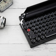 Qwerkywriter typewriter keyboard best in class premium all aluminum body in black chrome with a camera and a clock US ANSI layout