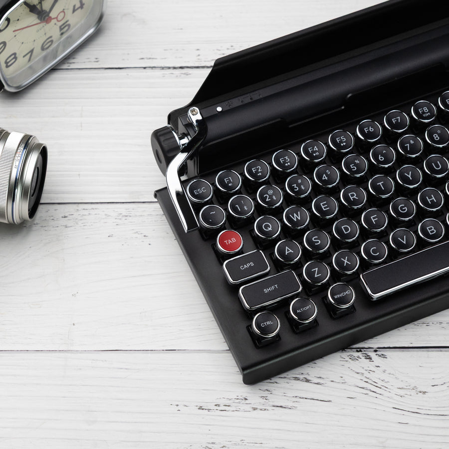 Qwerkywriter typewriter keyboard best in class premium all aluminum body in black chrome with a camera and a clock US ANSI layout