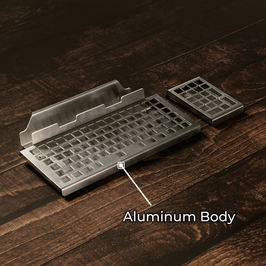 Qwerkywriter typewriter keyboard best in class premium all aluminum body on dark brown wood background aluminum chassis body