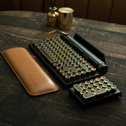 Qwerkywriter typewriter keyboard numkey numpad set best in class premium all aluminum body in black gold library scene with qwerkywriter official wrist rest brown