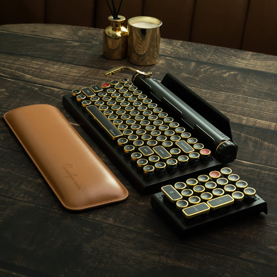 Qwerkywriter typewriter keyboard numkey numpad set best in class premium all aluminum body in black gold library scene with qwerkywriter official wrist rest brown