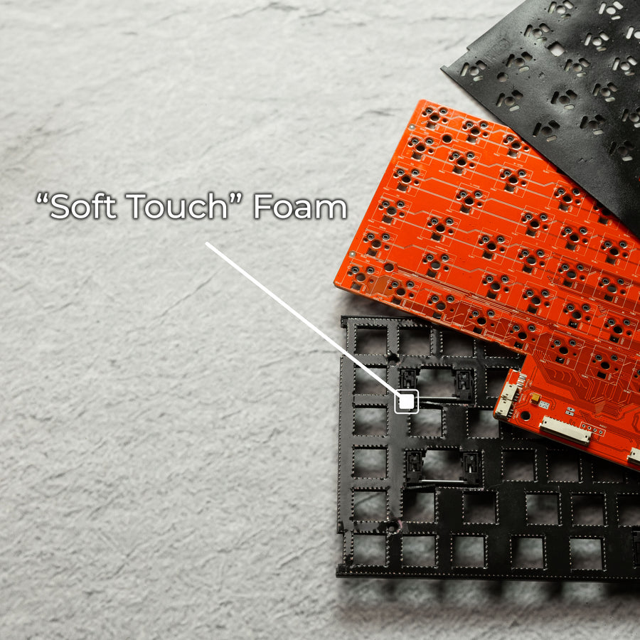 Qwerkywriter typewriter keyboard best in class premium all aluminum body close-up of 'Soft Touch' foam for bottoming out softer comfort with electronic components on a wooden surface