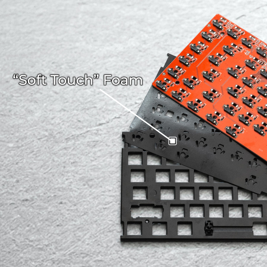 Qwerkywriter typewriter keyboard best in class premium all aluminum body close-up of 'Soft Touch' foam for bottoming out softer comfort with electronic components on a light surface
