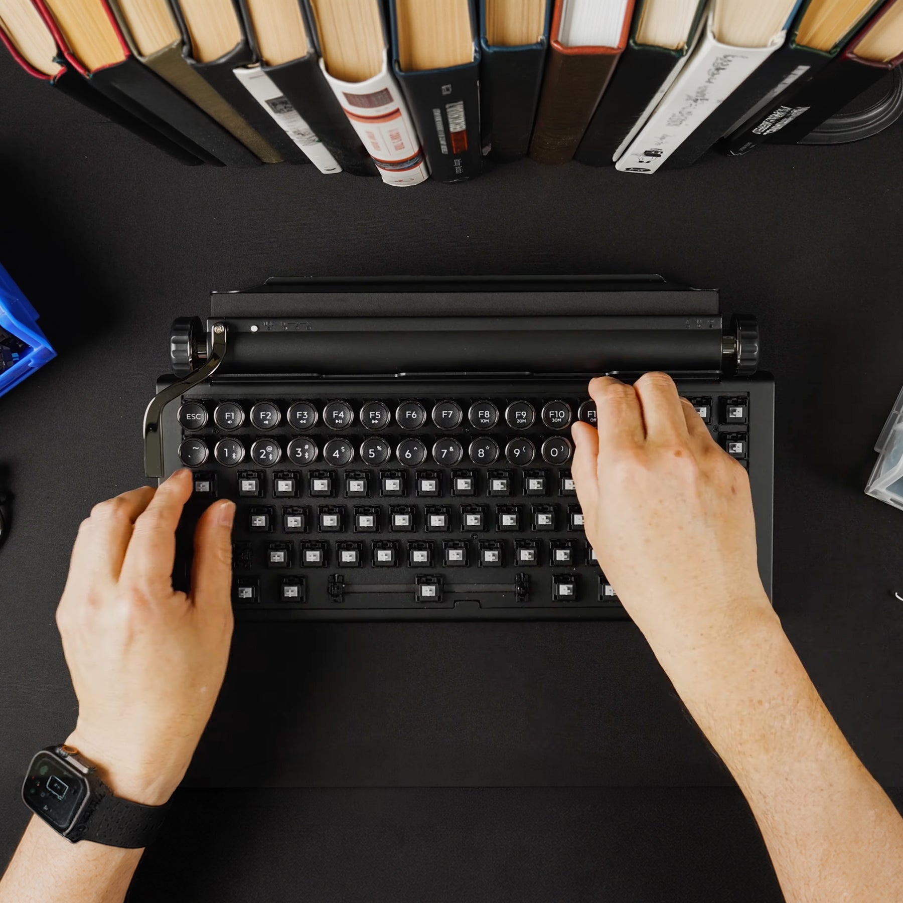 Qwerkywriter typewriter keyboard best in class premium all aluminum body switch installation on black desktop with books
