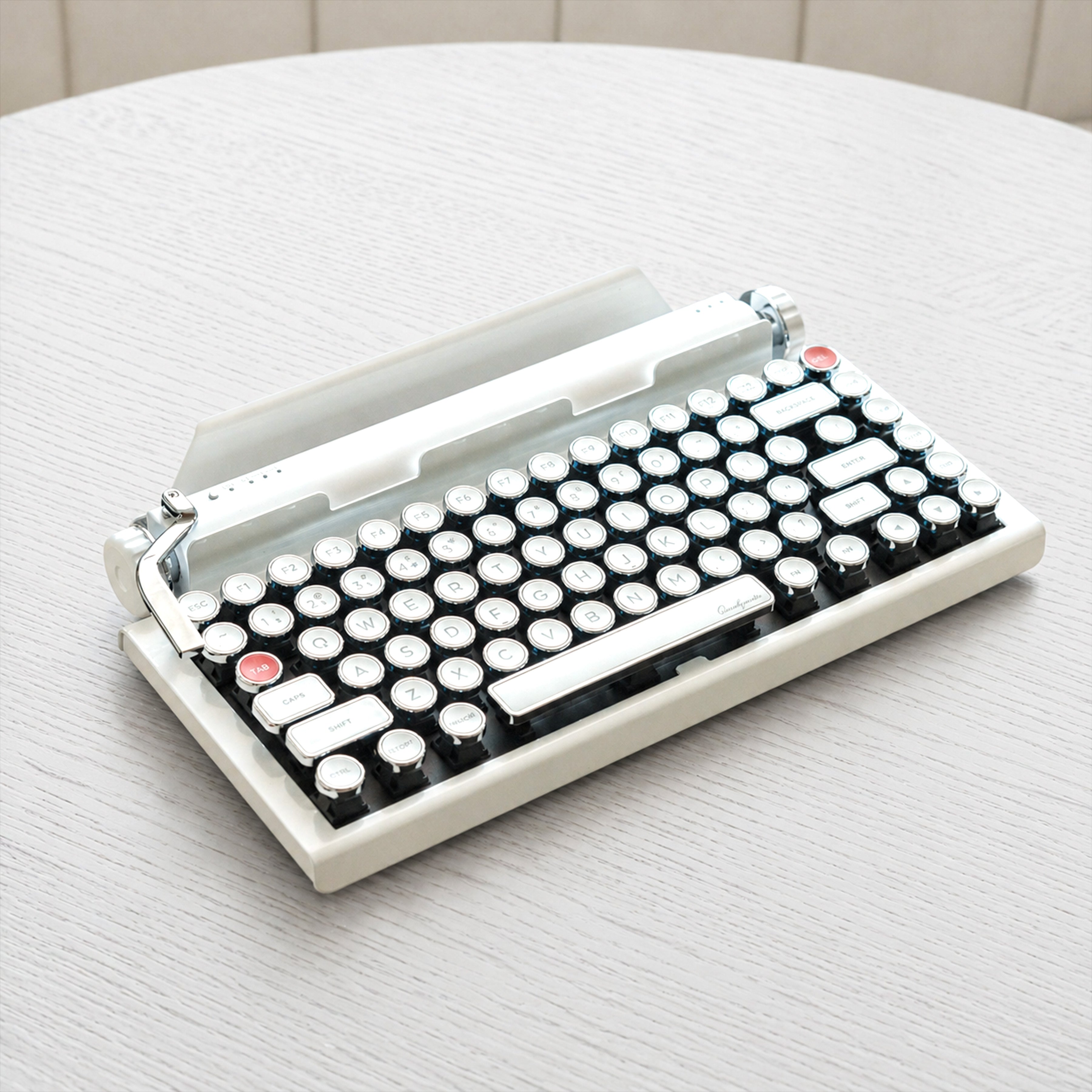 Qwerkywriter typewriter keyboard best in class premium all aluminum body in white chrome on light wood table hero image