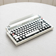 Qwerkywriter typewriter keyboard best in class premium all aluminum body in white chrome on light wood table hero image