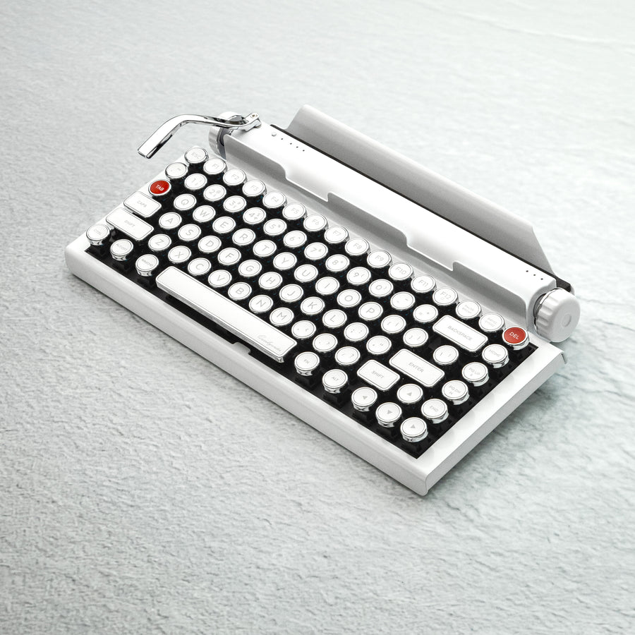 Qwerkywriter typewriter keyboard best in class premium all aluminum body in white chrome on light background with hot swap tool and cherry mx blue switch alternate angle