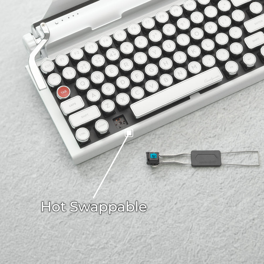 Qwerkywriter typewriter keyboard best in class premium all aluminum body in white chrome on light background with hot swap tool and cherry mx blue switch callout