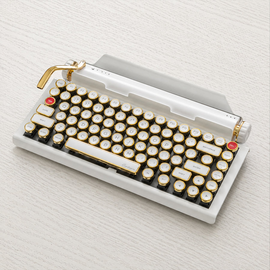 Qwerkywriter typewriter keyboard best in class premium all aluminum body in white gold on light color wood table