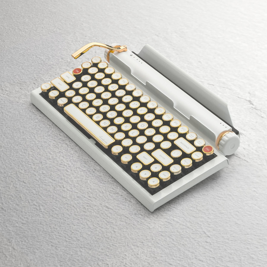 Qwerkywriter typewriter keyboard best in class premium all aluminum body in white gold on light color wood table