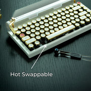 Qwerkywriter typewriter keyboard best in class premium all aluminum body in white gold on dark wood background hot swappable callout