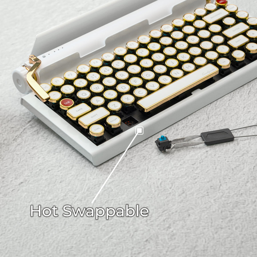 Qwerkywriter typewriter keyboard best in class premium all aluminum body in white gold on light background hot swappable callout