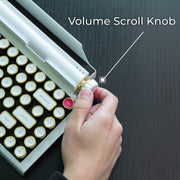 Qwerkywriter typewriter keyboard best in class premium all aluminum body in white gold on dark wood background page scroll and volume knob